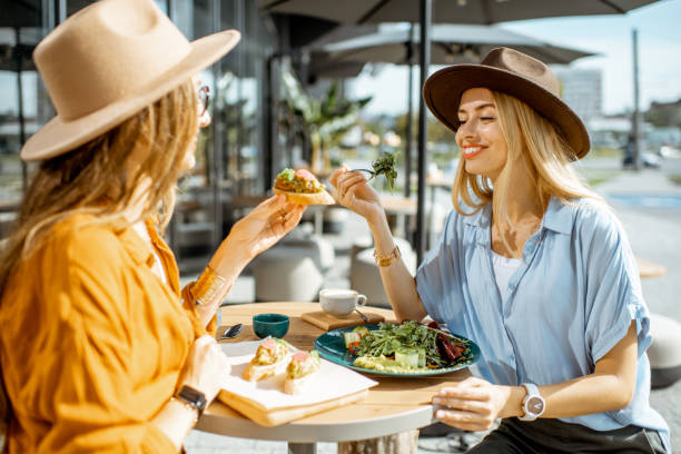 istock Girlfriends eating healthy food on a terrace 1170247642