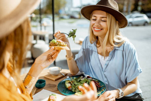 istock Girlfriends eating healthy food on a terrace 1170247706