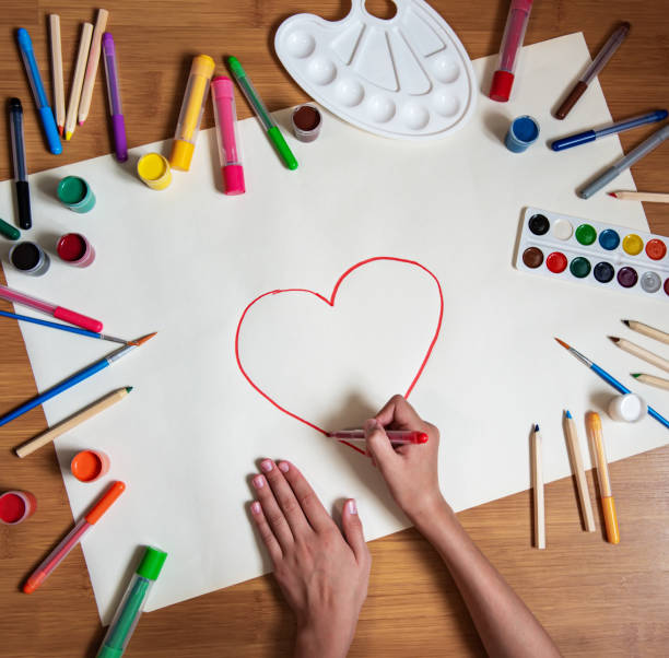 istock Little girl drawing in paper 1170247792