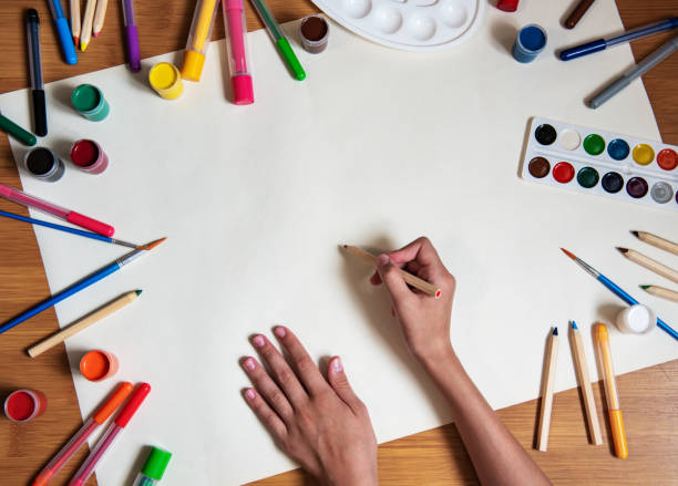 istock Little girl drawing in paper 1170247814