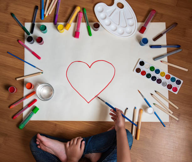 istock Little girl drawing in paper 1170247991