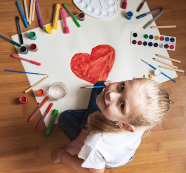 istock Little girl drawing in paper 1170247994