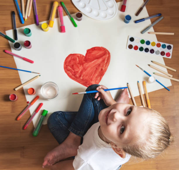 istock Little girl drawing in paper 1170247998