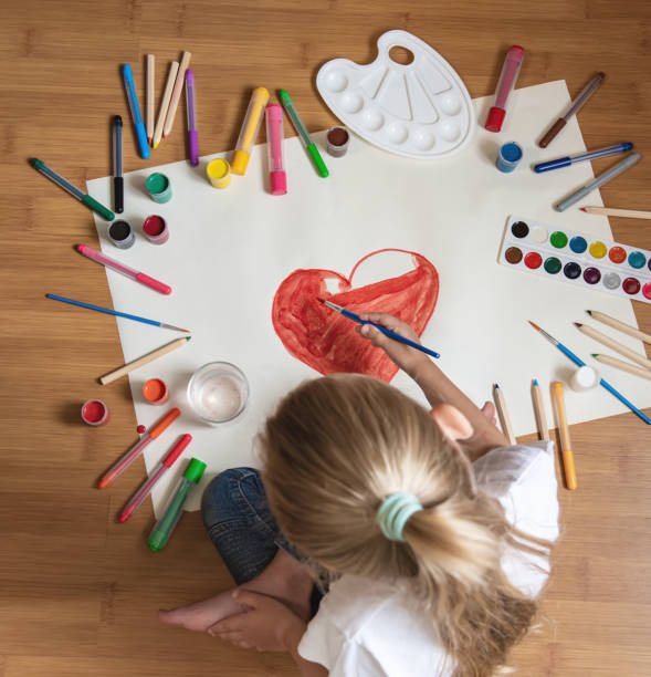 istock Little girl drawing in paper 1170248041