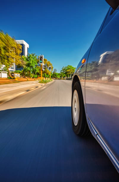 istock Sedan car speeding in town 1170249546