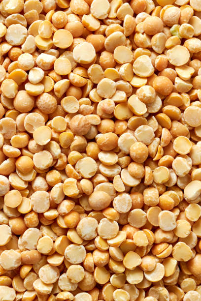istock Background made of yellow split peas. 1170250743