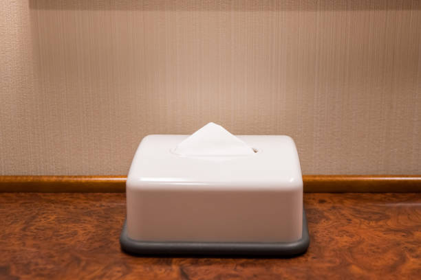 White box tissue on wooden table In hotel room stock photo