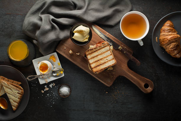 Breakfast served with orange juice, croissants, egg and toast. Delicious healthy breakfast.