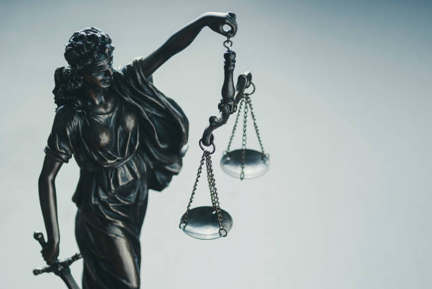 istock Metallic silver statue of Justice holding scales 1170256232