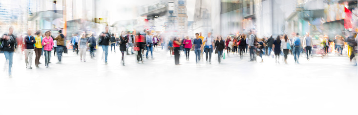 Lots of people walking in London, blurred panoramic image with space for text