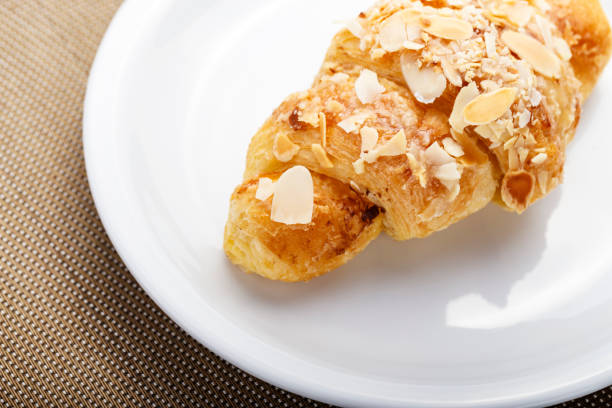 istock Fresh croissant in a plate on the table. 1170258481