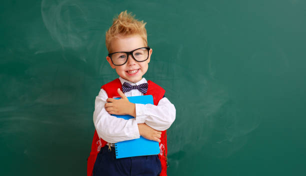 istock funny child boy student about school blackboard 1170259266