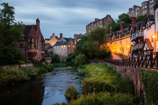 istock Historic buildings along a river at twilight 1170264882
