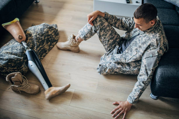 istock Disabled veteran US soldier sitting alone at home 1170268557