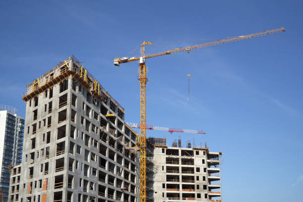 istock Construction site, building a new house, cranes, blue sky 1170271173