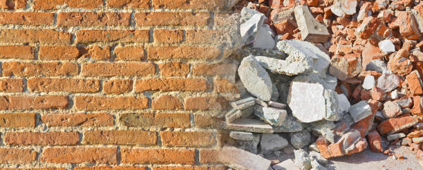 istock Concrete and brick wall rubble debris on construction site after a demolition of a brick building - image with copy space 1170271314