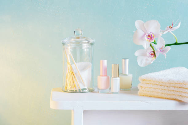 Spa and manicure products on the table Spa and manicure products on the table across the blue wall in sunlight, pastel composition with orchid life stile stock pictures, royalty-free photos & images