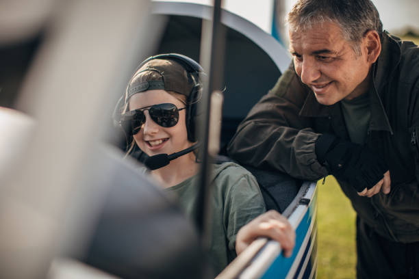 istock Little girl sitting in cockpit 1170273733