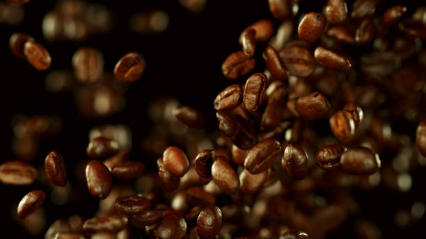 istock Fresh roasted coffee beans flying in the air 1170275647