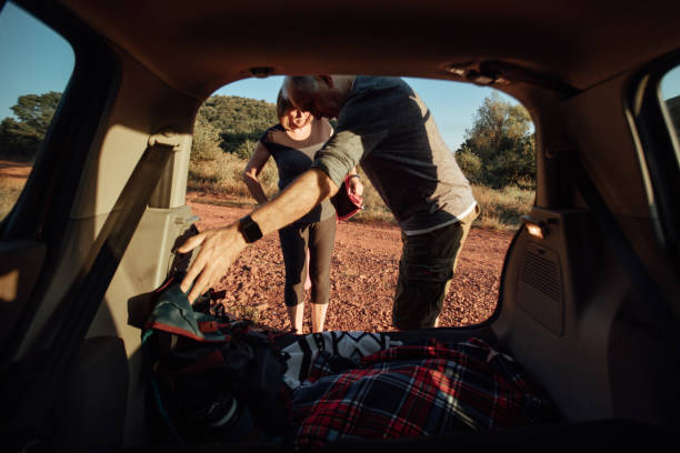 istock Senior couple packing car boot with luggage 1170276697