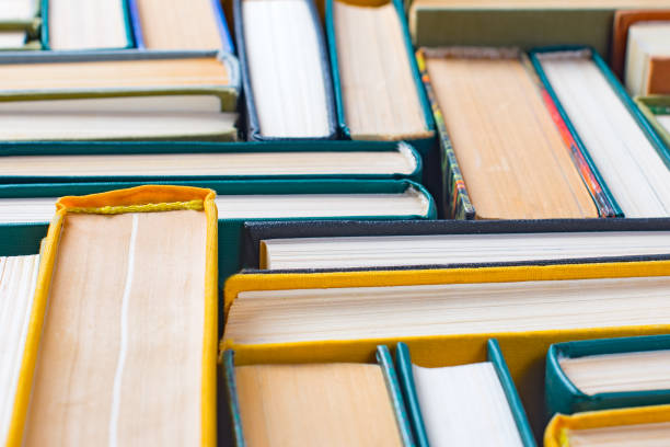 istock Old books and textbooks lined with mosaics, selective focus. 1170278158