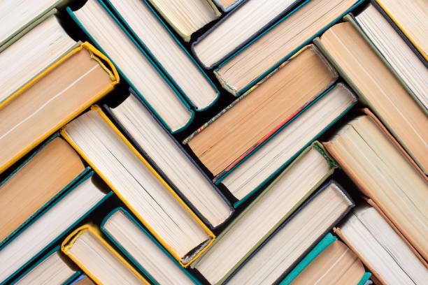 istock Books and textbooks lined with mosaics, top view 1170278179