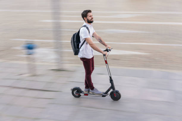 istock Young man speeding with his e-scooter in the city 1170278276