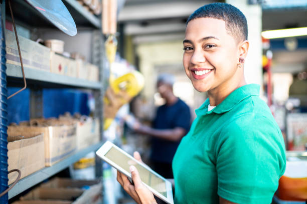 istock Portrait of a young woman using computer digital tablet in a paint store 1170279257