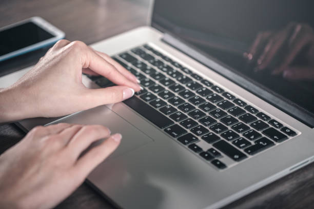 istock Getting down to work. Woman working on a laptop. 1170279380