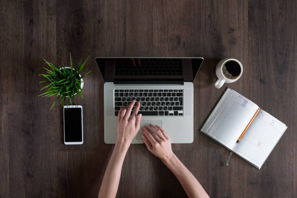 istock Woman uses laptop at work 1170279417