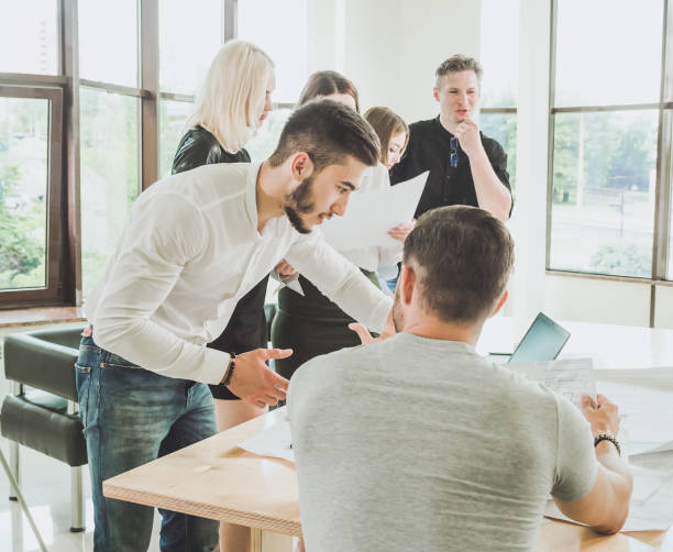 istock Fresh ideas in a young team during the discussion approval by the authorities 1170280227