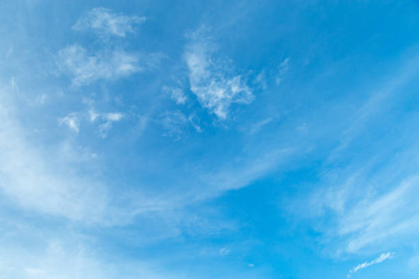 istock white clouds on blue sky in clearly day. 1170283010