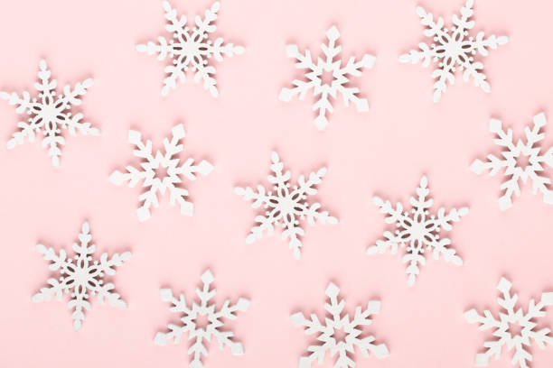 istock Christmas background. White snow decorations on a pink background. 1170283234