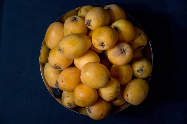 istock Medlars in a stainless steal fruit bowl 1170284966