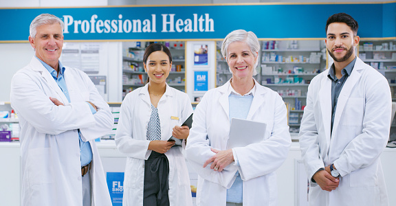 Portrait of a group of pharmacists standing together in a chemist