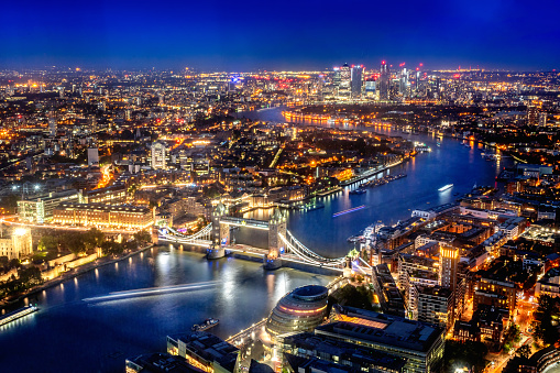 Aerial view over London skyline at night