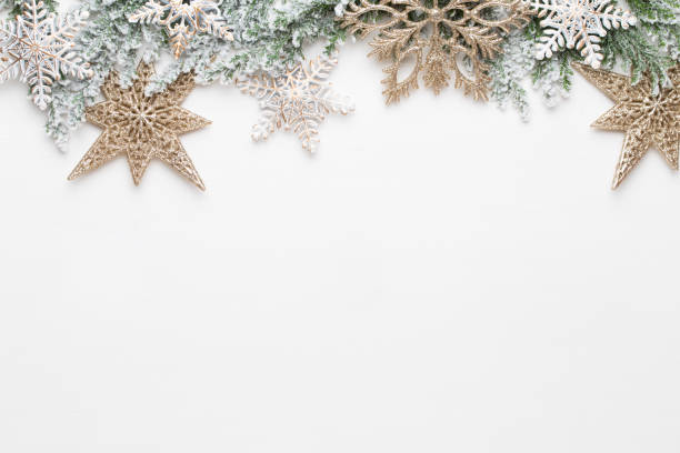 istock Christmas white Fir tree branches with gold stars decorations. 1170287803