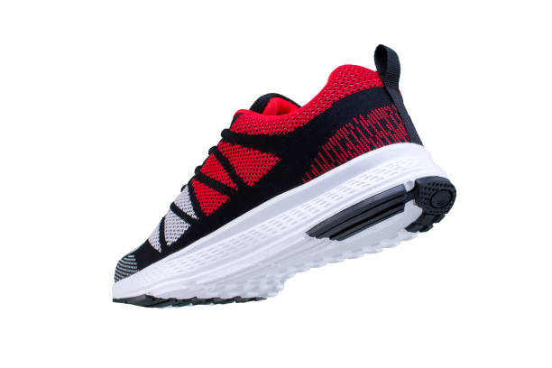 istock Red sneaker with black on a white background. Sport shoes 1170289870