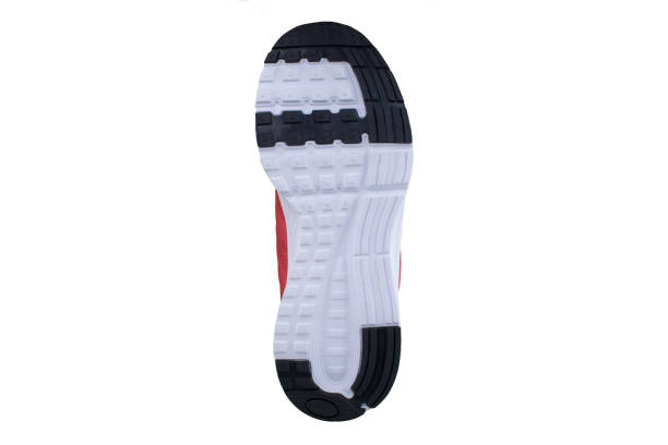 istock White-gray rubber sole with sneakers on a white background. 1170289954