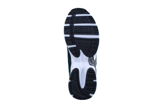 istock Black sole sneakers with white stripes on a white background. 1170290023