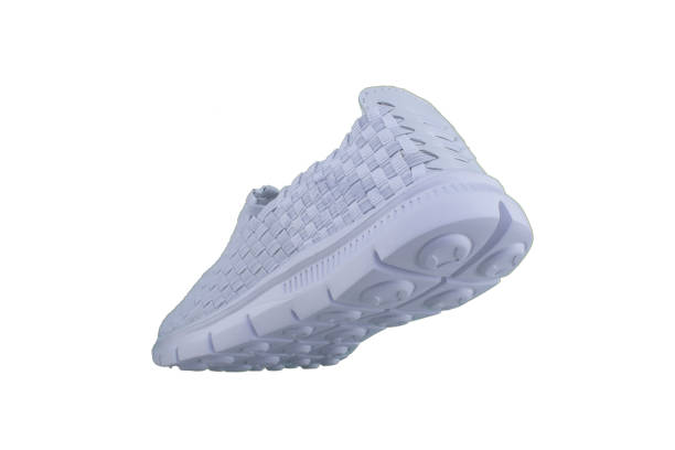 istock White sneaker on a white sole. Sport shoes on a white background. 1170291400