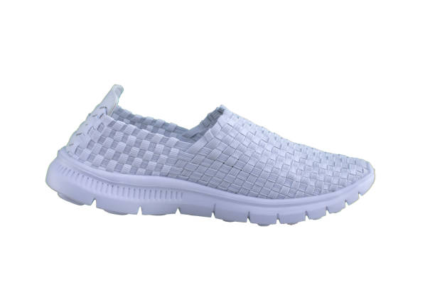 istock White sneaker on a white sole. Sport shoes on a white background. 1170291497