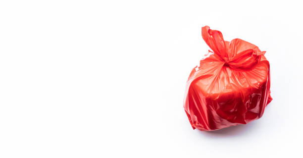 istock Food trash packing in red plastic bag on white color background. 1170291682