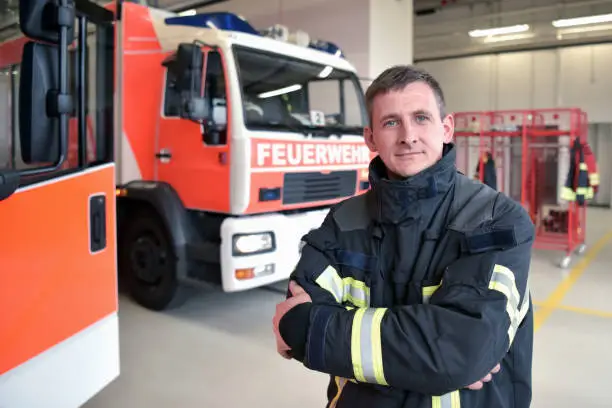 portrait of a firefighter in the operations centre at the fire-fighting vehicle