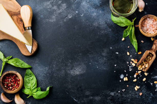 istock Ingredients for making traditional italian pesto sauce on old dark rustic background. Flat lay. 1170292970