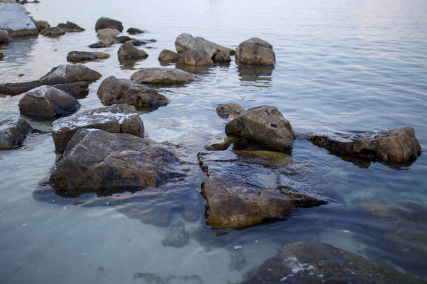istock Beautiful rocks on beach by the sea 1170293009