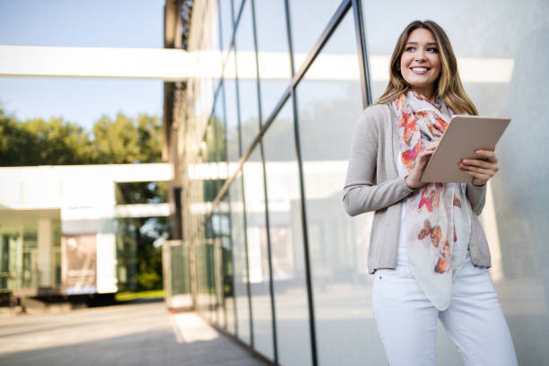 istock Beautiful brunette girl using tablet for work, freelance, blogging, studying, shopping 1170293470
