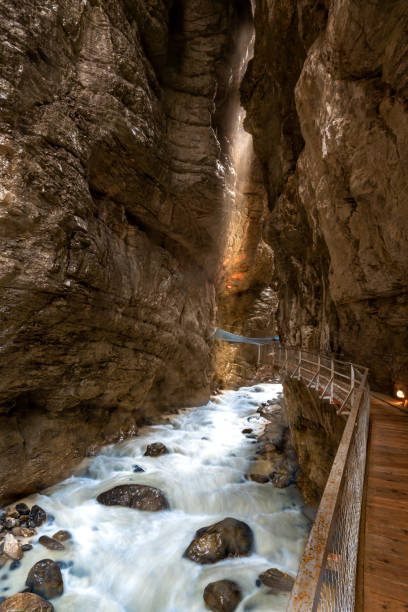 Glacier gorge in Grindelwald Glacier gorge with the river Weisse Lutschine and the climbing net Spiderweb in Grindelwald in the Bernese Oberland in Switzerland Grindlewald stock pictures, royalty-free photos & images