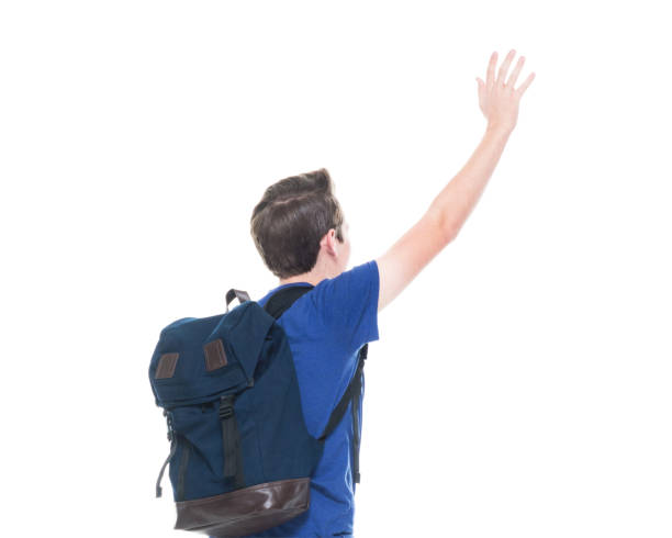istock Young high school age male student is waving 1170296585