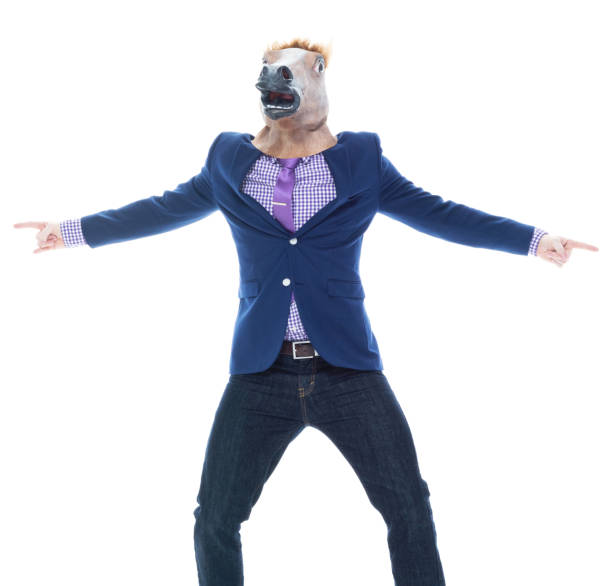 istock Businessman with horse mask is dancing 1170297194